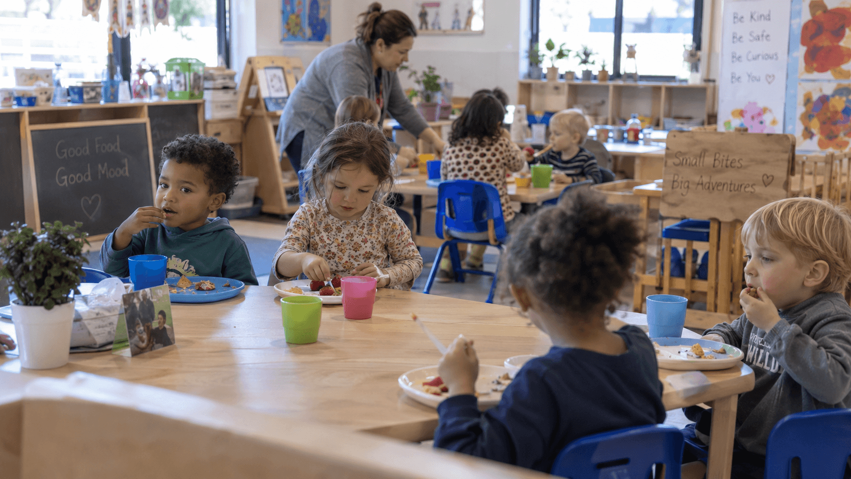 Children enjoying a meal together at the daycare